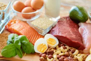 High-protein foods including salmon, eggs, lean beef, and nuts – essential for weight loss tips for women over 30